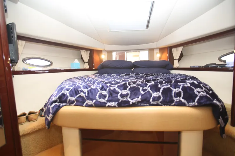 Slide: The Image of Luxurious cabin interior of 2010 Sea Ray 390 Sundancer yacht with cozy bedding. - 21