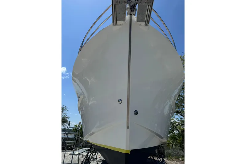 Slide: The Image of 2007 Beneteau Swift Trawler 42, front view, docked under clear blue sky. - 38