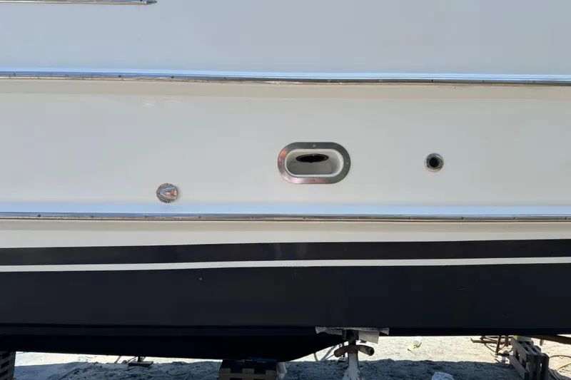 Slide: The Image of 2007 Beneteau Swift Trawler 42 hull detail with fittings and black stripe. - 39