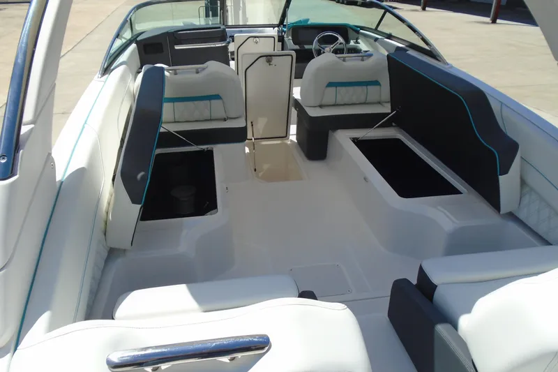 Slide: The Image of 2022 Regal LX6 boat interior with spacious seating and modern design. - 9