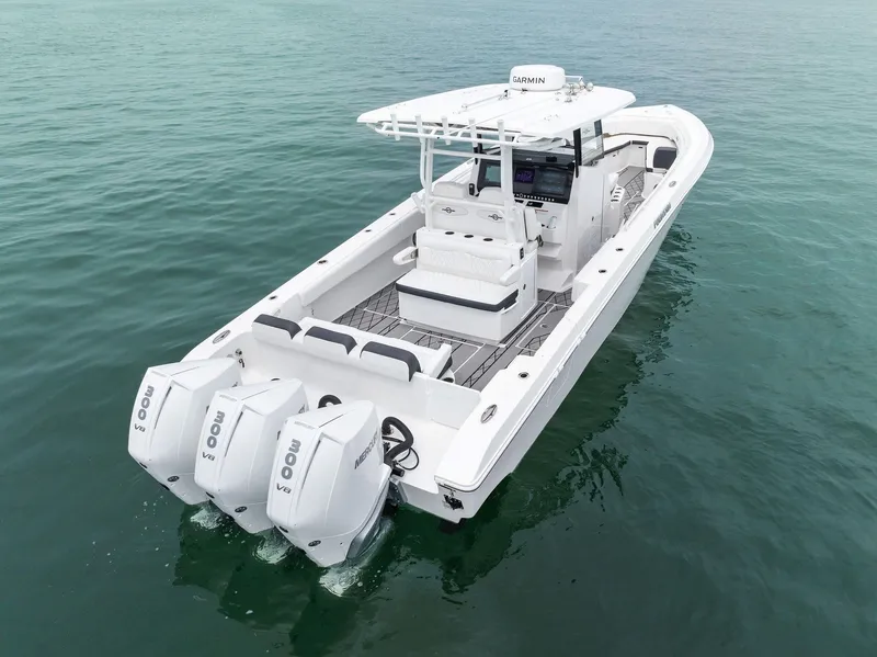 The Image of 2023 Fountain 38 CC boat with triple outboard engines on open water. - 0