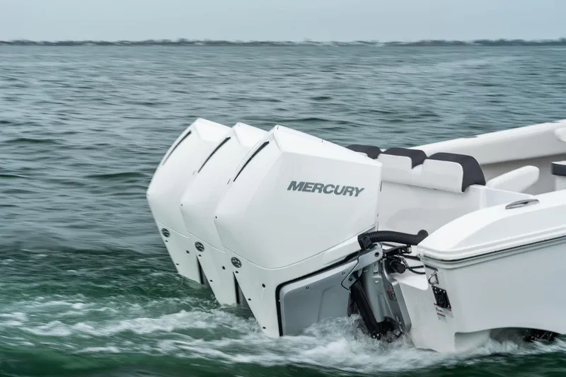 Slide: The Image of 2023 Fountain 38 CC boat with triple Mercury outboard engines on water. - 10