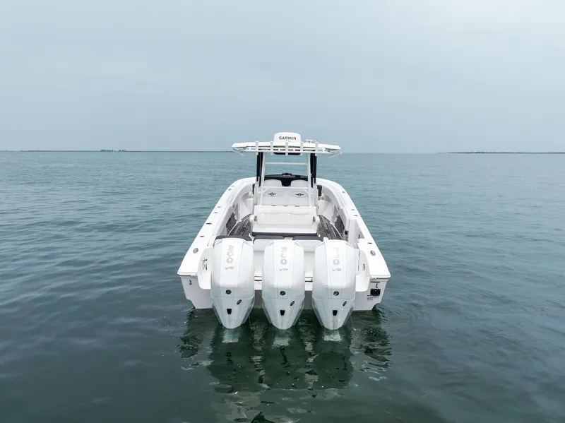 Slide: The Image of 2023 Fountain 38 CC boat with quad engines on open water. - 13