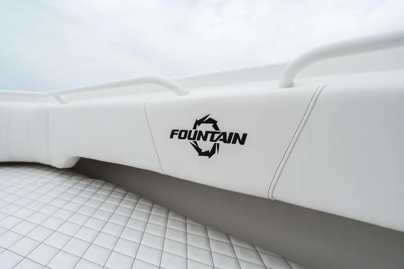 Slide: The Image of 2023 Fountain 38 CC boat interior with logo and white upholstery. - 16