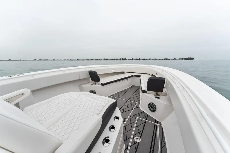 Slide: The Image of 2023 Fountain 38 CC boat interior with seating and ocean view. - 17