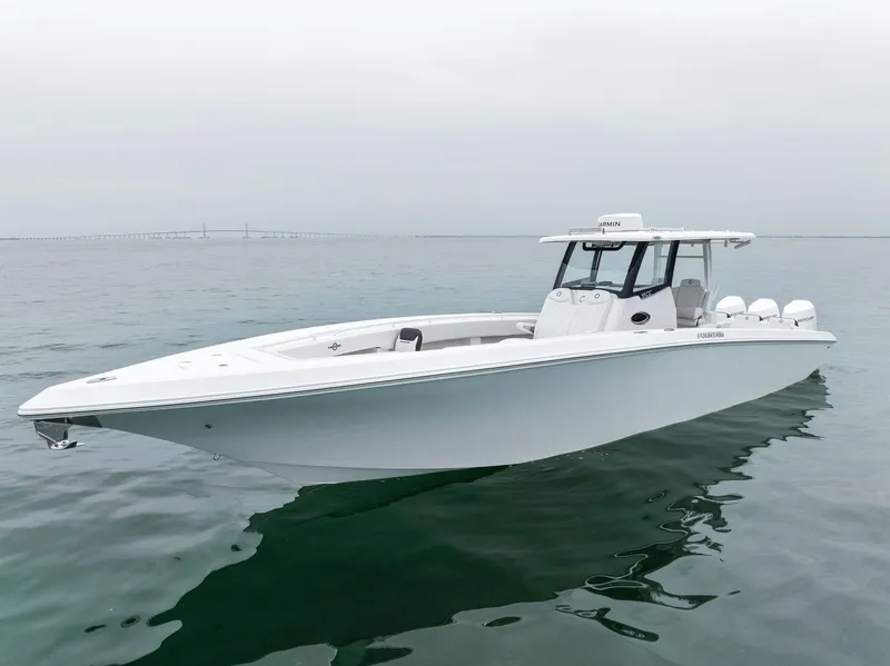 Slide: The Image of 2023 Fountain 38 CC boat on calm water. - 2