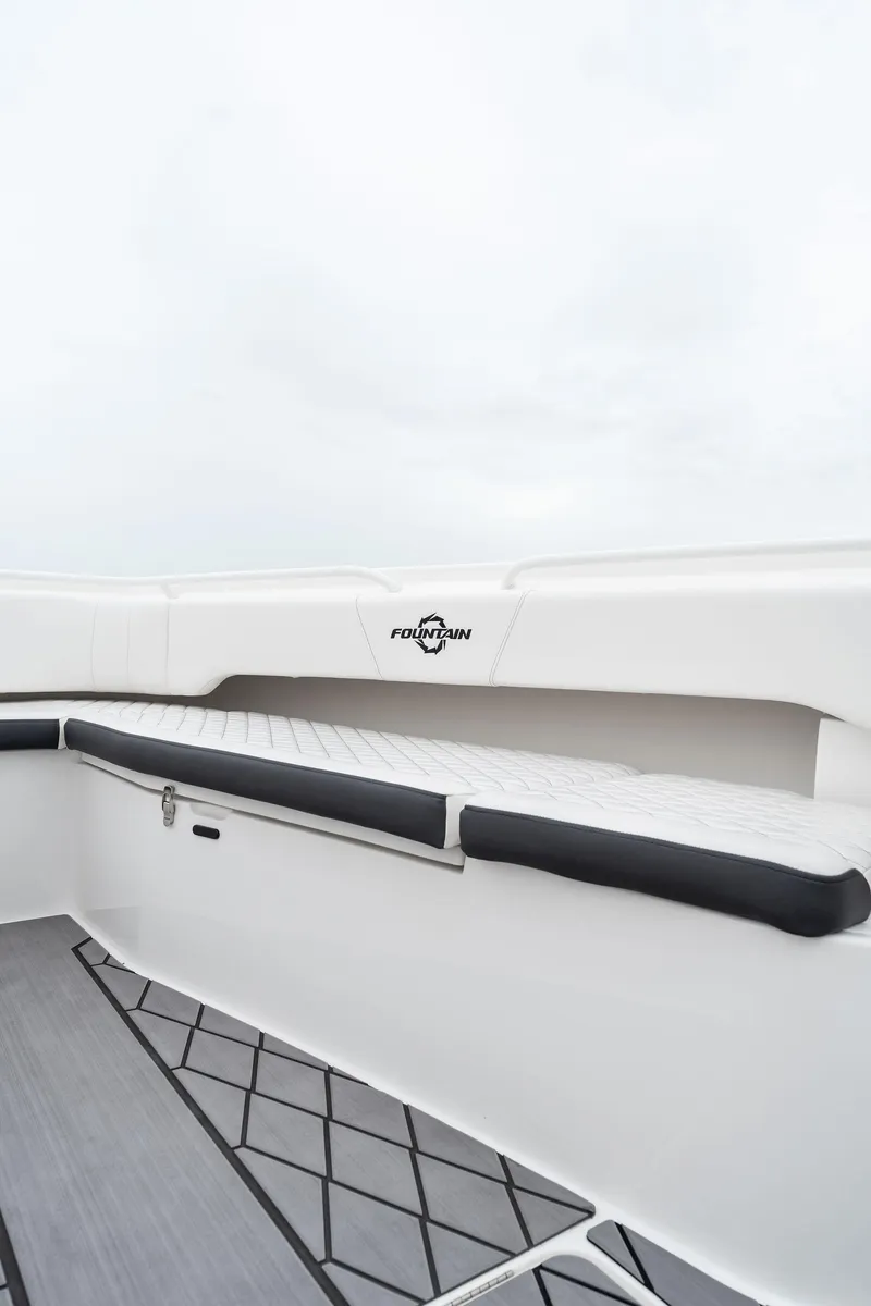 Slide: The Image of 2023 Fountain 38 CC boat interior with cushioned seating. - 21