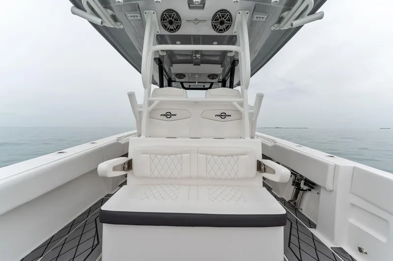 Slide: The Image of 2023 Fountain 38 CC boat interior with seating and speakers. - 25