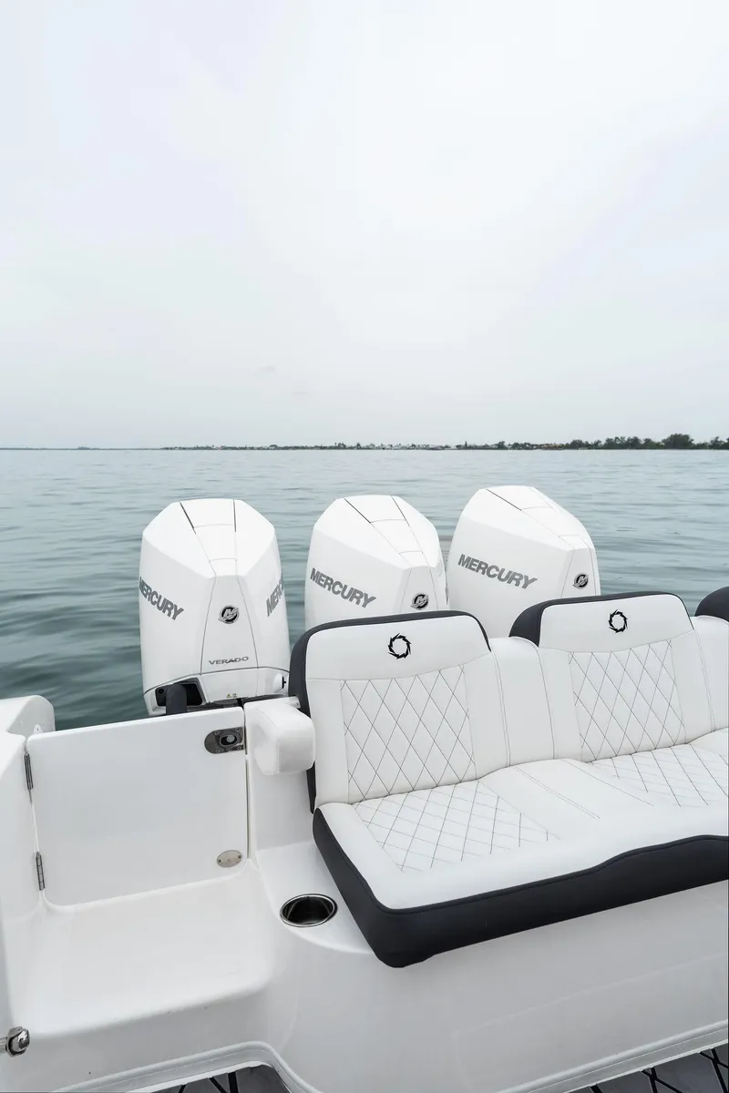 Slide: The Image of 2023 Fountain 38 CC boat with Mercury engines on calm water. - 27