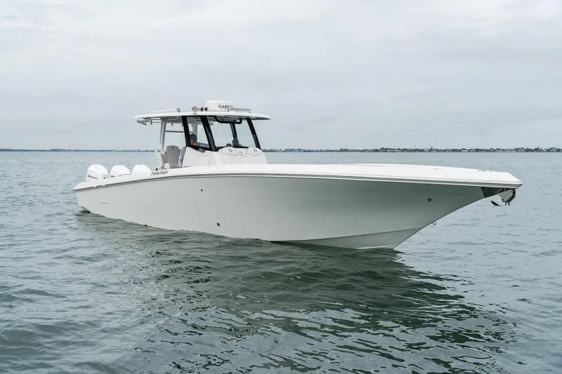 Slide: The Image of 2023 Fountain 38 CC boat on calm water. - 30