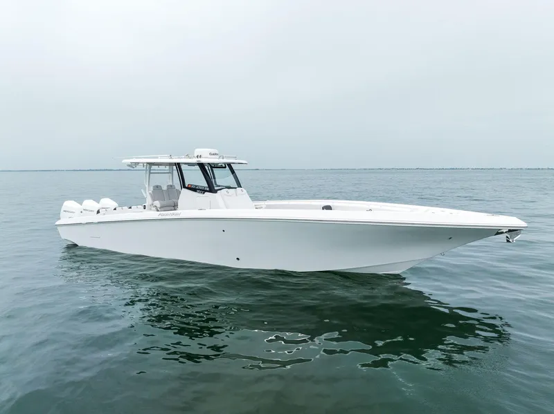 Slide: The Image of 2023 Fountain 38 CC boat on calm water. - 4