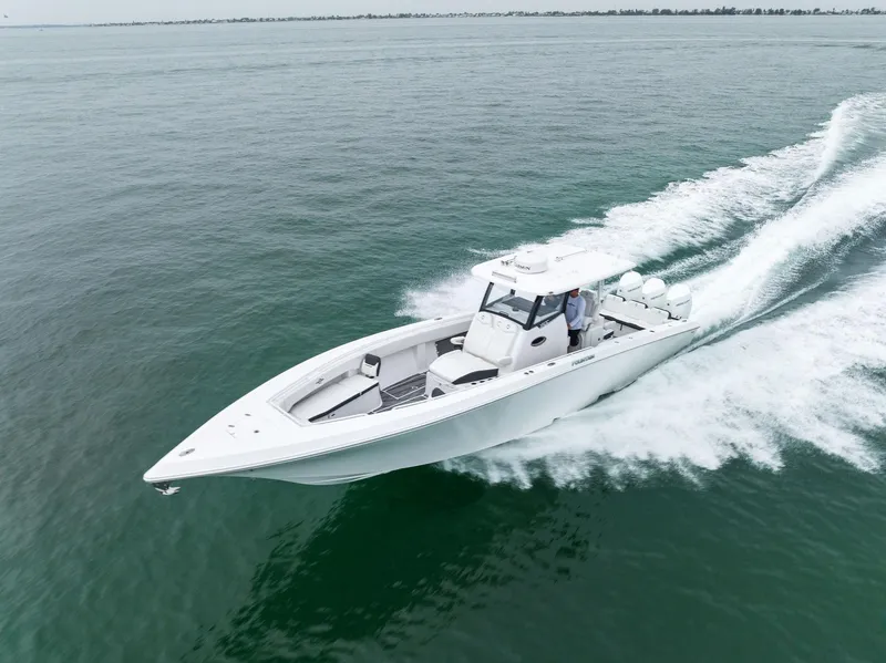 Slide: The Image of 2023 Fountain 38 CC boat cruising on open water. - 7