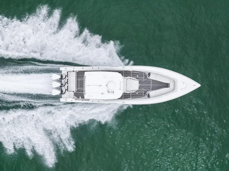 Slide: The Image of Aerial view of 2023 Fountain 38 CC boat speeding on water. - 9