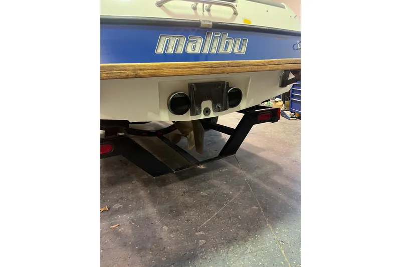 Slide: The Image of Rear view of a 2005 Malibu 21 Ride boat on a trailer. - 8