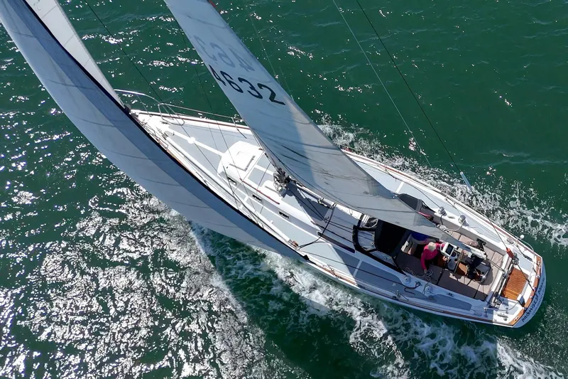 Slide: The Image of Aerial view of a 1970 Morgan 42 MKI sailboat navigating through clear ocean waters. - 15