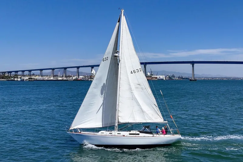 Slide: The Image of 1970 Morgan 42 MKI sailboat cruising near a bridge on a sunny day. - 3