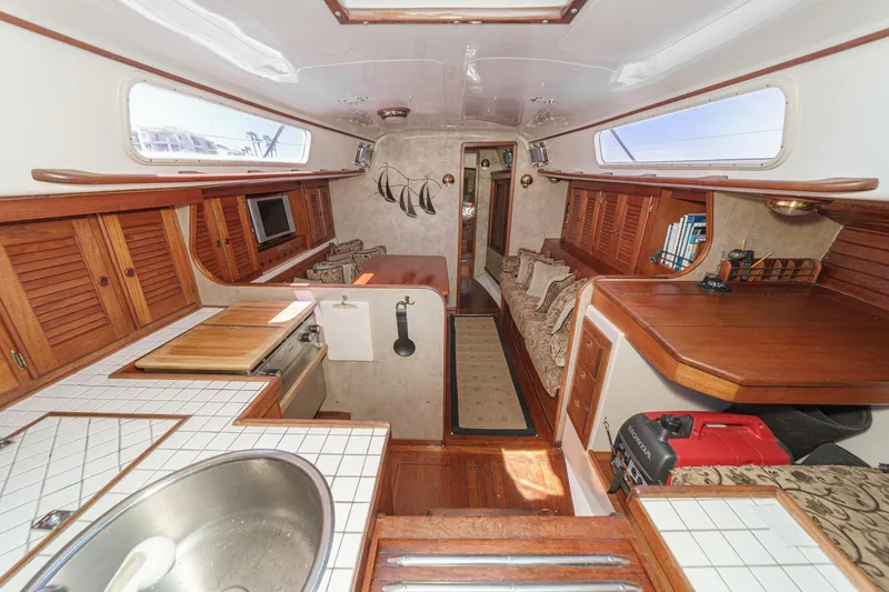 Slide: The Image of Interior of a 1970 Morgan 42 MKI sailboat with wood accents and cozy seating. - 36