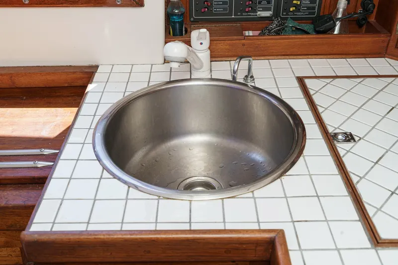 Slide: The Image of Stainless steel sink on a 1970 Morgan 42 MKI yacht with tiled countertop. - 41