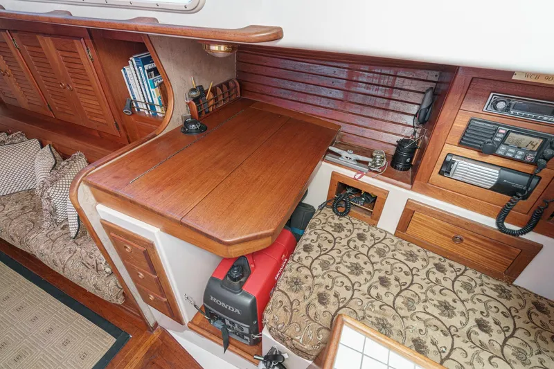 Slide: The Image of Interior of a 1970 Morgan 42 MKI sailboat with wooden cabinetry and navigation equipment. - 45