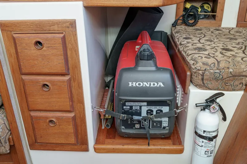 Slide: The Image of 1970 Morgan 42 MKI interior with Honda generator and fire extinguisher. - 46
