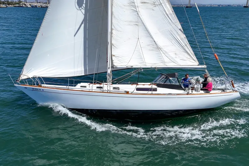 Slide: The Image of Sailing yacht Morgan 42 MKI 1970 gliding on blue ocean waters. - 5
