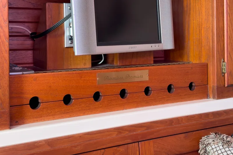 Slide: The Image of Wooden interior of a 1970 Morgan 42 MKI yacht with a mounted TV. - 54