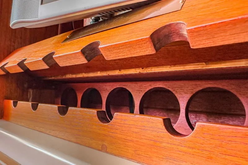Slide: The Image of Wooden interior detail of a 1970 Morgan 42 MKI sailboat, showcasing storage compartments. - 55