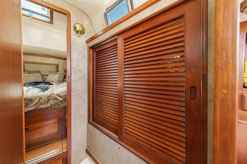 Slide: The Image of Interior of a 1970 Morgan 42 MKI yacht with wooden sliding doors and cozy bedroom. - 59