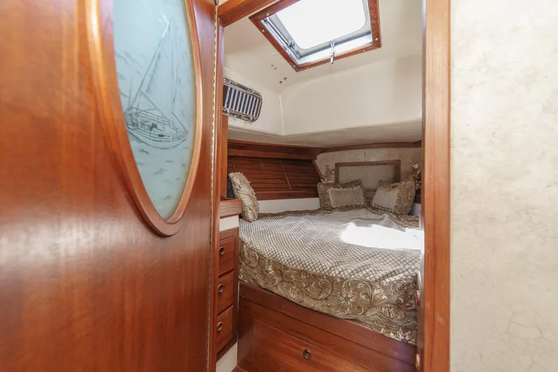 Slide: The Image of Cozy cabin interior of a 1970 Morgan 42 MKI sailboat with elegant wood finish. - 60