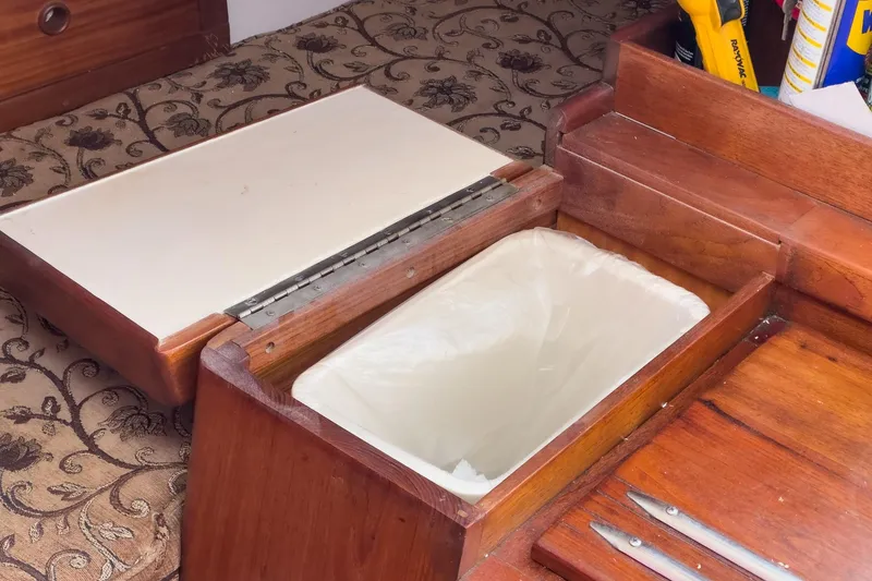 Slide: The Image of Wooden interior of 1970 Morgan 42 MKI with built-in trash compartment. - 70