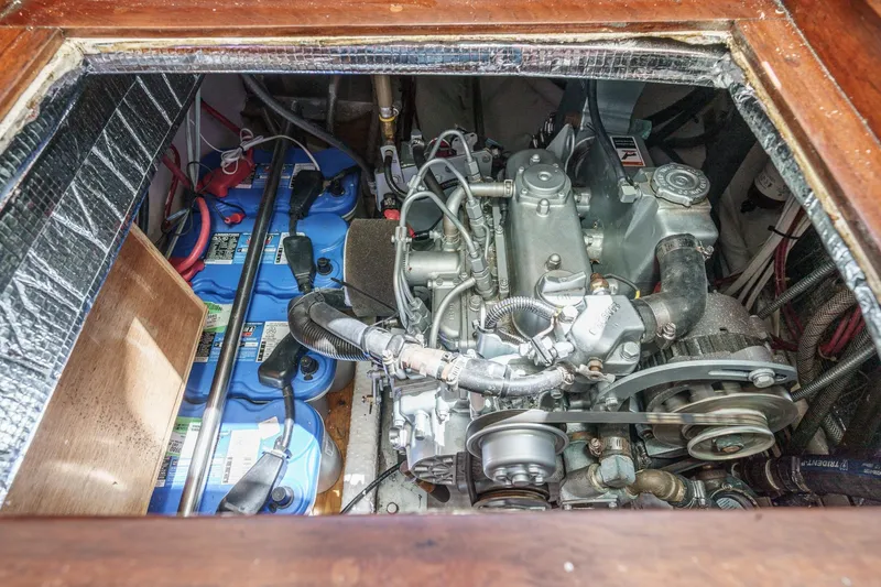 Slide: The Image of Engine compartment of a 1970 Morgan 42 MKI sailboat, showcasing mechanical components. - 72