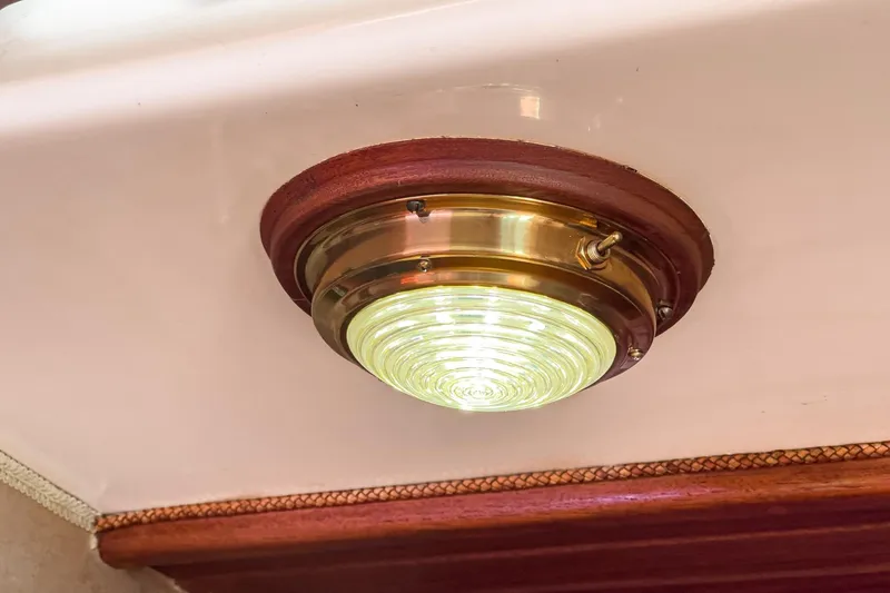 Slide: The Image of Vintage brass ceiling light fixture on 1970 Morgan 42 MKI yacht interior. - 76