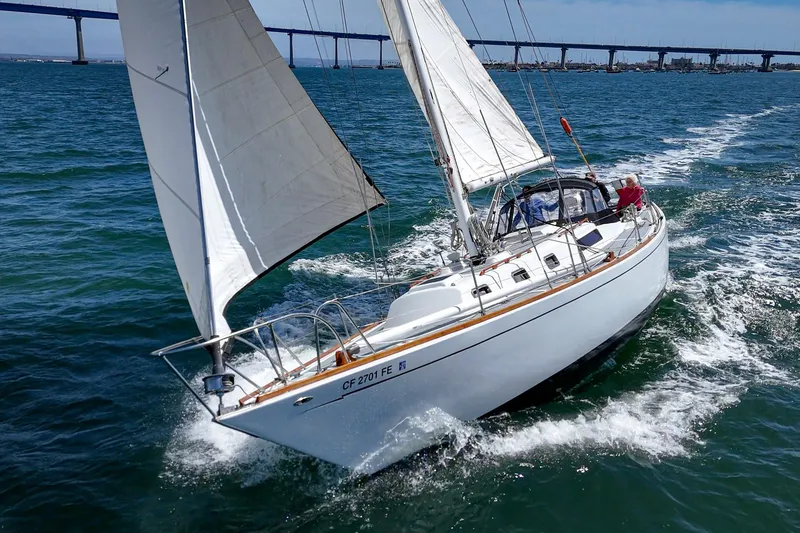 Slide: The Image of 1970 Morgan 42 MKI sailboat navigating ocean waters with bridge in background. - 8