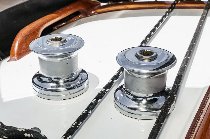 Slide: The Image of Chrome winches on a 1970 Morgan 42 MKI sailboat deck with ropes. - 80