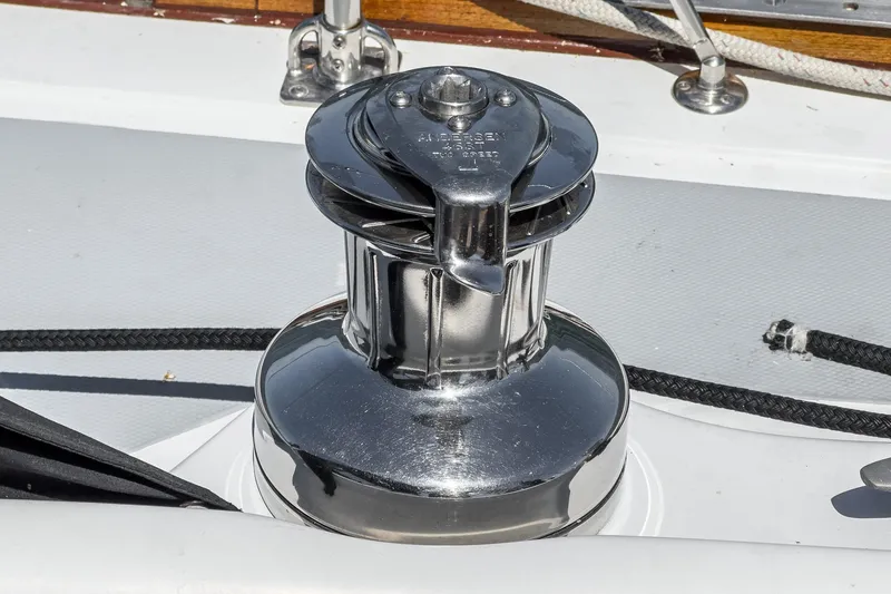 Slide: The Image of Chrome winch on 1970 Morgan 42 MKI sailboat deck, with ropes and fittings. - 81