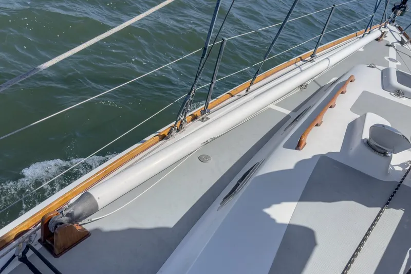 Slide: The Image of 1970 Morgan 42 MKI sailboat deck with wooden trim and ocean view. - 84