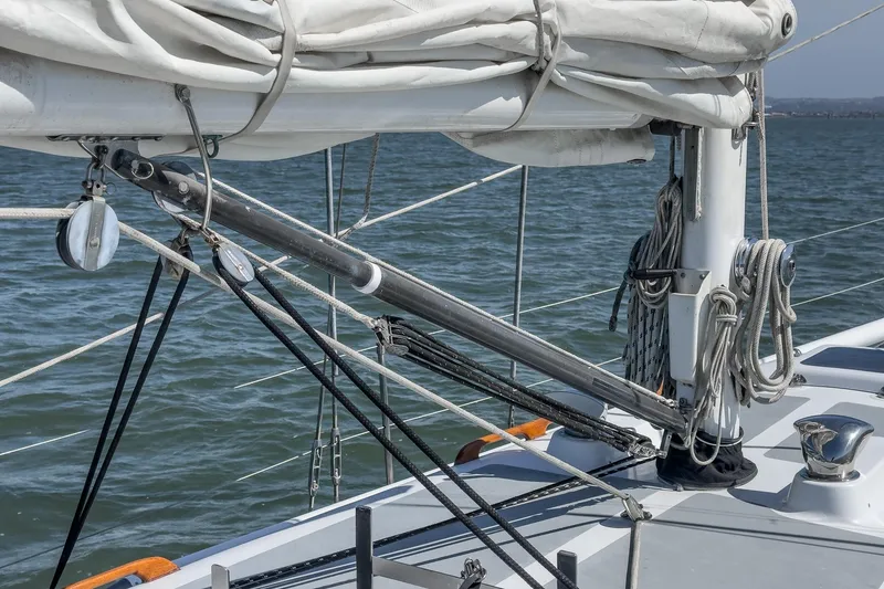 Slide: The Image of 1970 Morgan 42 MKI sailboat deck with rigging and sails, on calm water. - 86