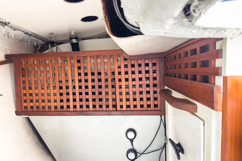 Slide: The Image of Interior of a 1970 Morgan 42 MKI sailboat featuring wooden latticework and nautical details. - 91