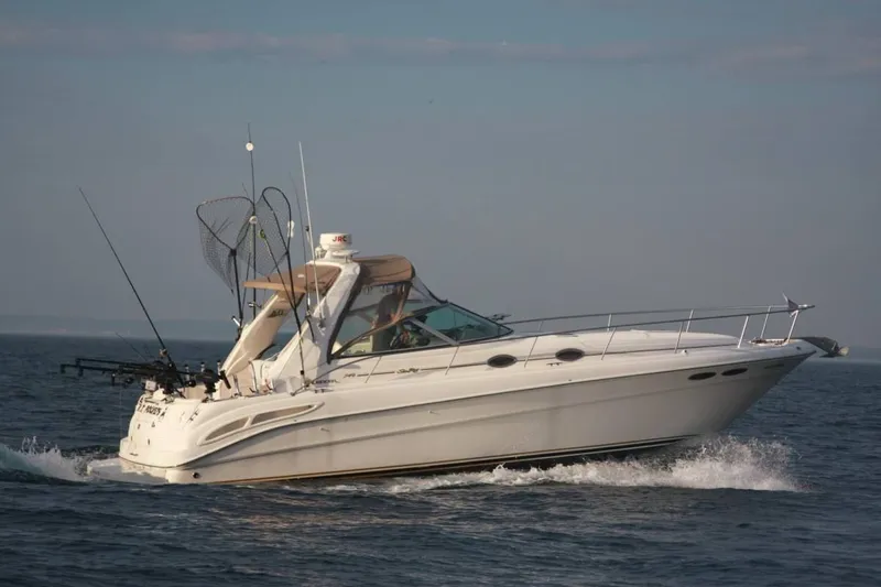 The Image of 1999 Sea Ray 340 Sundancer cruising on the water. - 0