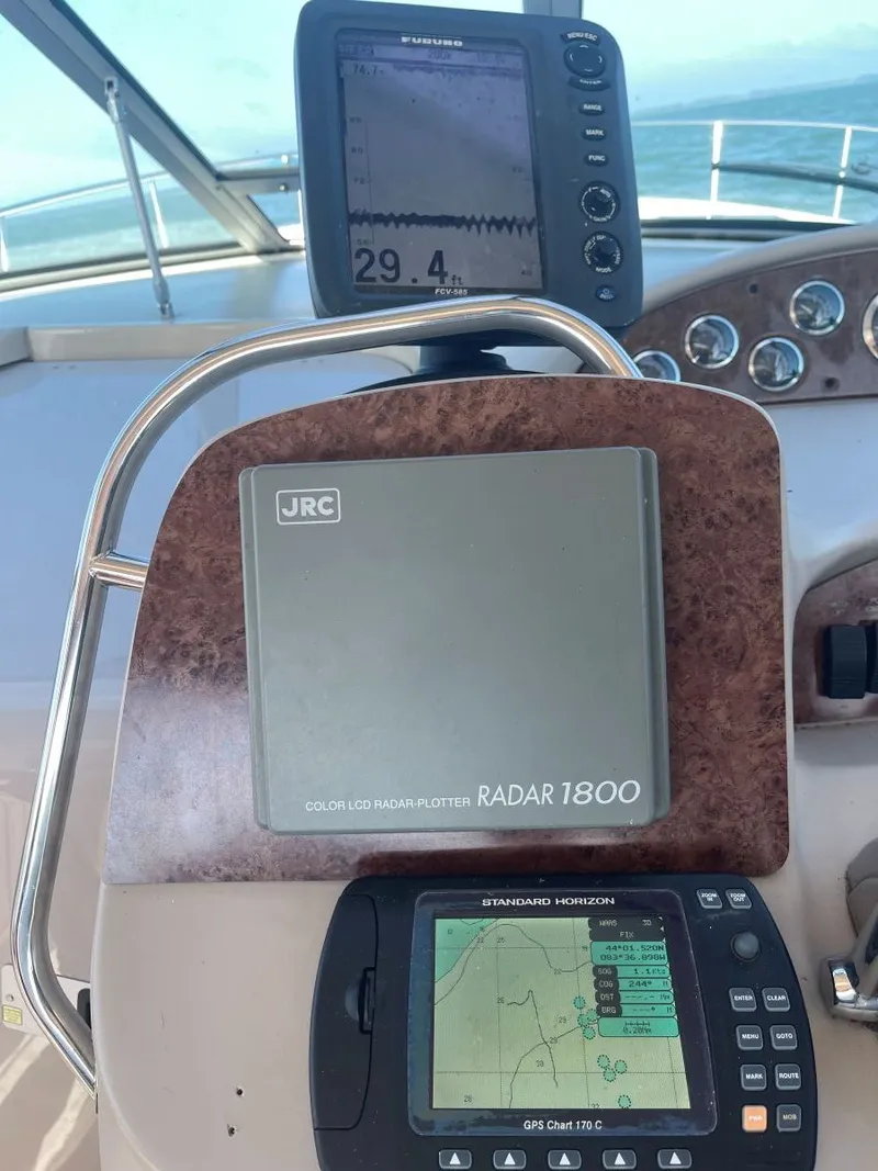 Slide: The Image of Navigation systems on a 1999 Sea Ray 340 Sundancer boat. - 11