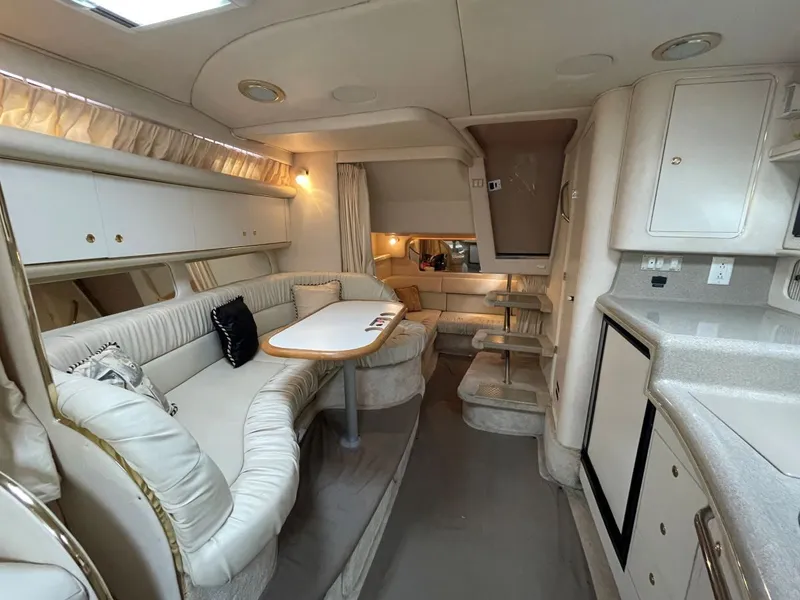 Slide: The Image of Interior of 1999 Sea Ray 340 Sundancer with elegant seating area. - 12