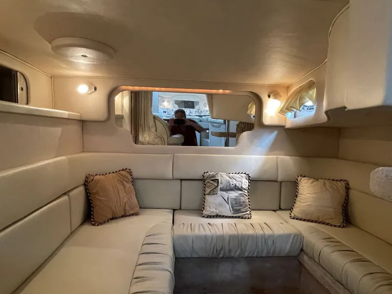 Slide: The Image of Interior of 1999 Sea Ray 340 Sundancer with beige sofa. - 13
