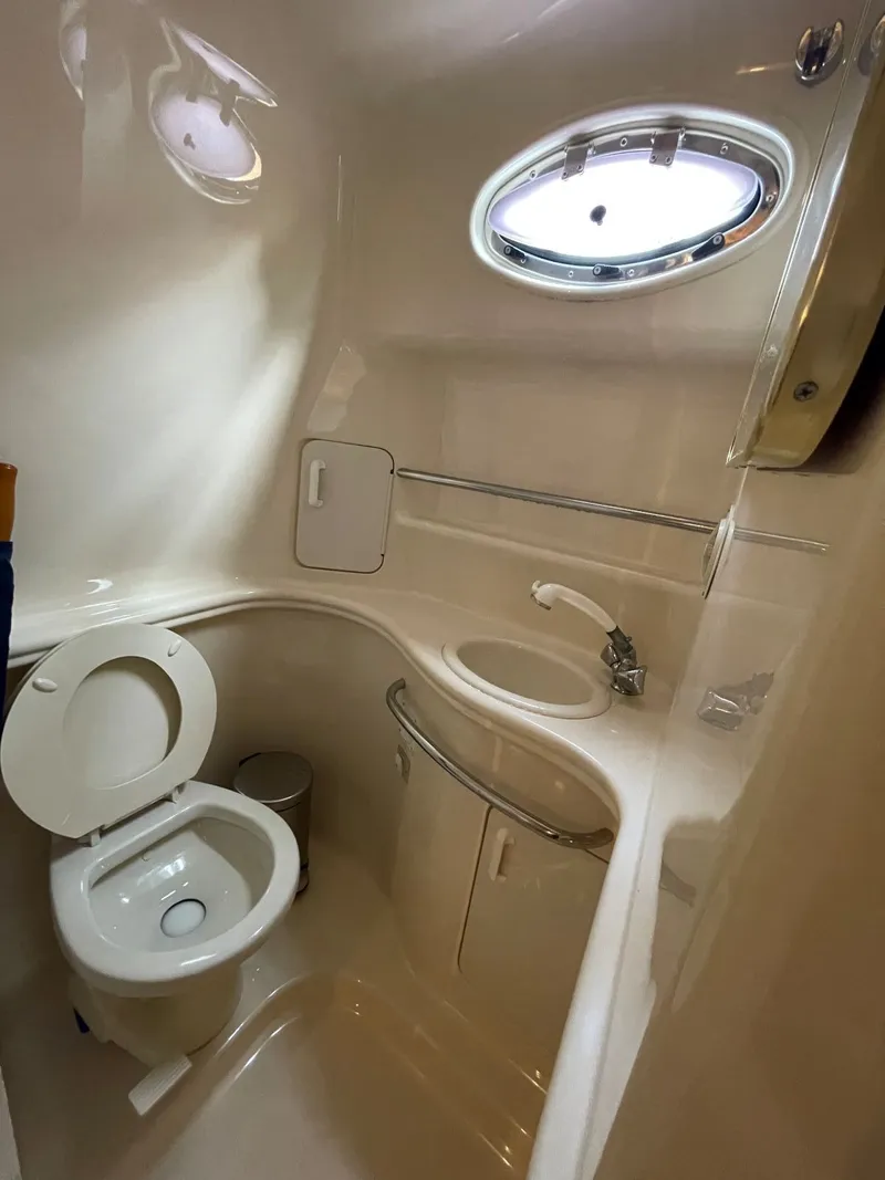 Slide: The Image of Interior view of the bathroom on a 1999 Sea Ray 340 Sundancer yacht. - 14