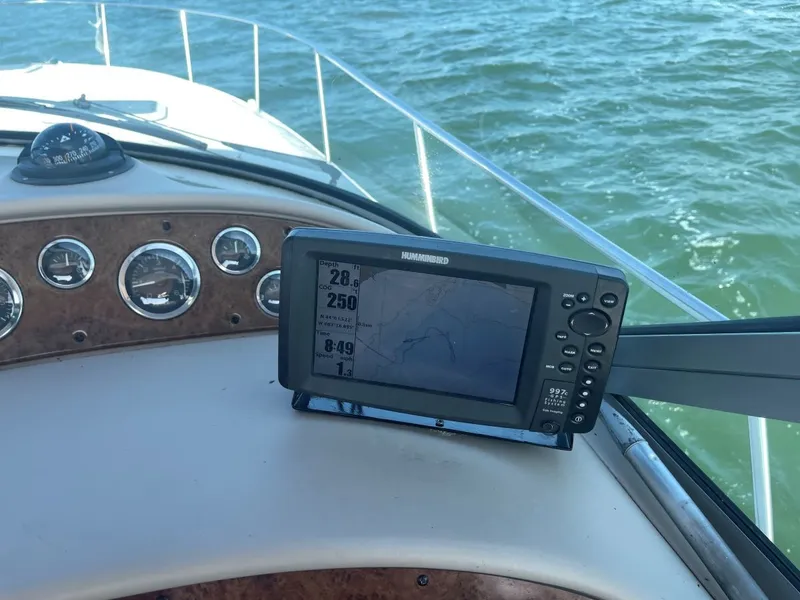 Slide: The Image of 1999 Sea Ray 340 Sundancer dashboard with depth finder. - 16