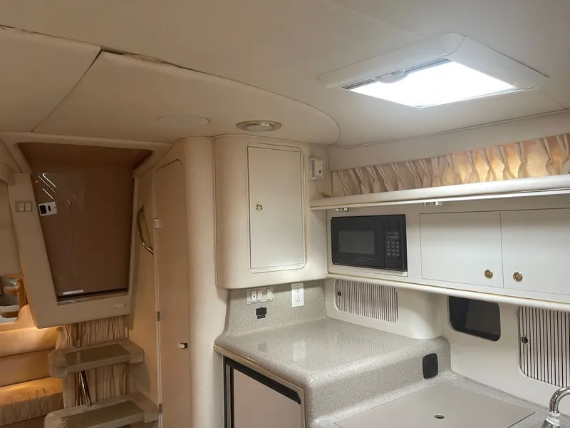 Slide: The Image of Interior of 1999 Sea Ray 340 Sundancer with kitchen and microwave. - 20