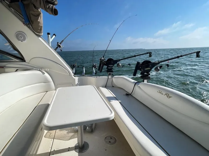 Slide: The Image of Interior of a 1999 Sea Ray 340 Sundancer with fishing rods. - 4