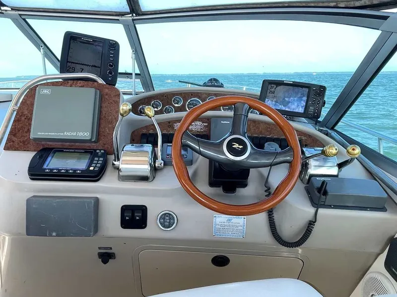 Slide: The Image of 1999 Sea Ray 340 Sundancer helm with navigation equipment. - 7
