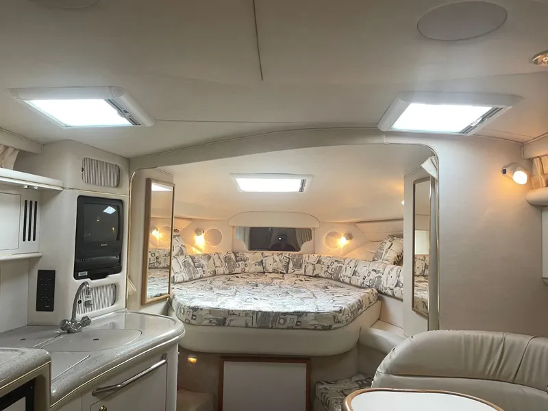 Slide: The Image of Interior of 1999 Sea Ray 340 Sundancer with cozy bed and kitchenette. - 9