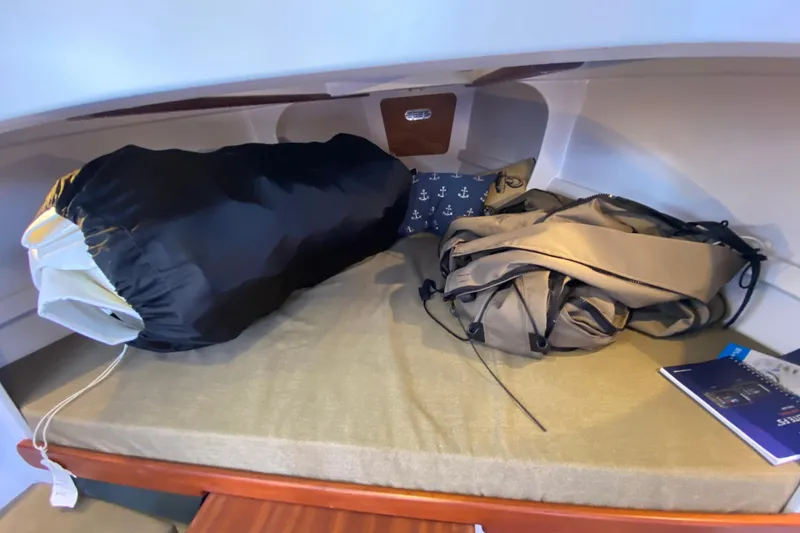 Slide: The Image of Cozy cabin interior of 2013 Devlin Onyx boat with bags and nautical decor. - 22
