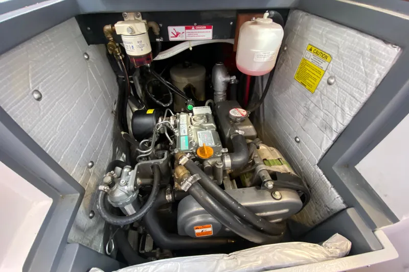 Slide: The Image of Engine compartment of a 2013 Devlin Onyx, showcasing detailed mechanical components. - 28